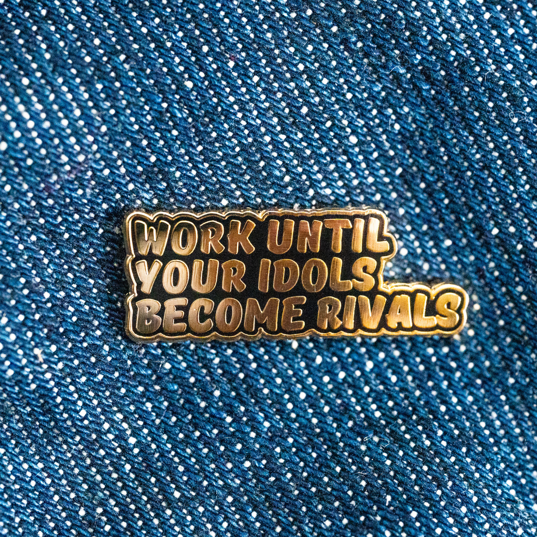 Work Until Your Idols Become Rivals Enamel Pin